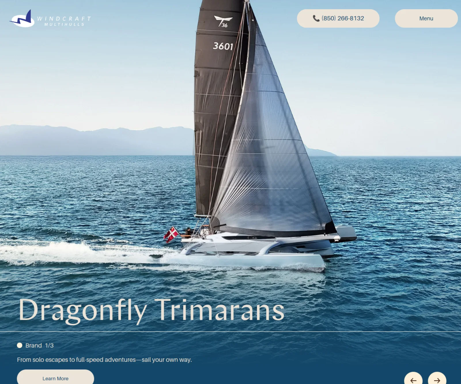 Windcraft Multihulls homepage featuring a Dragonfly trimaran sailing at sea
